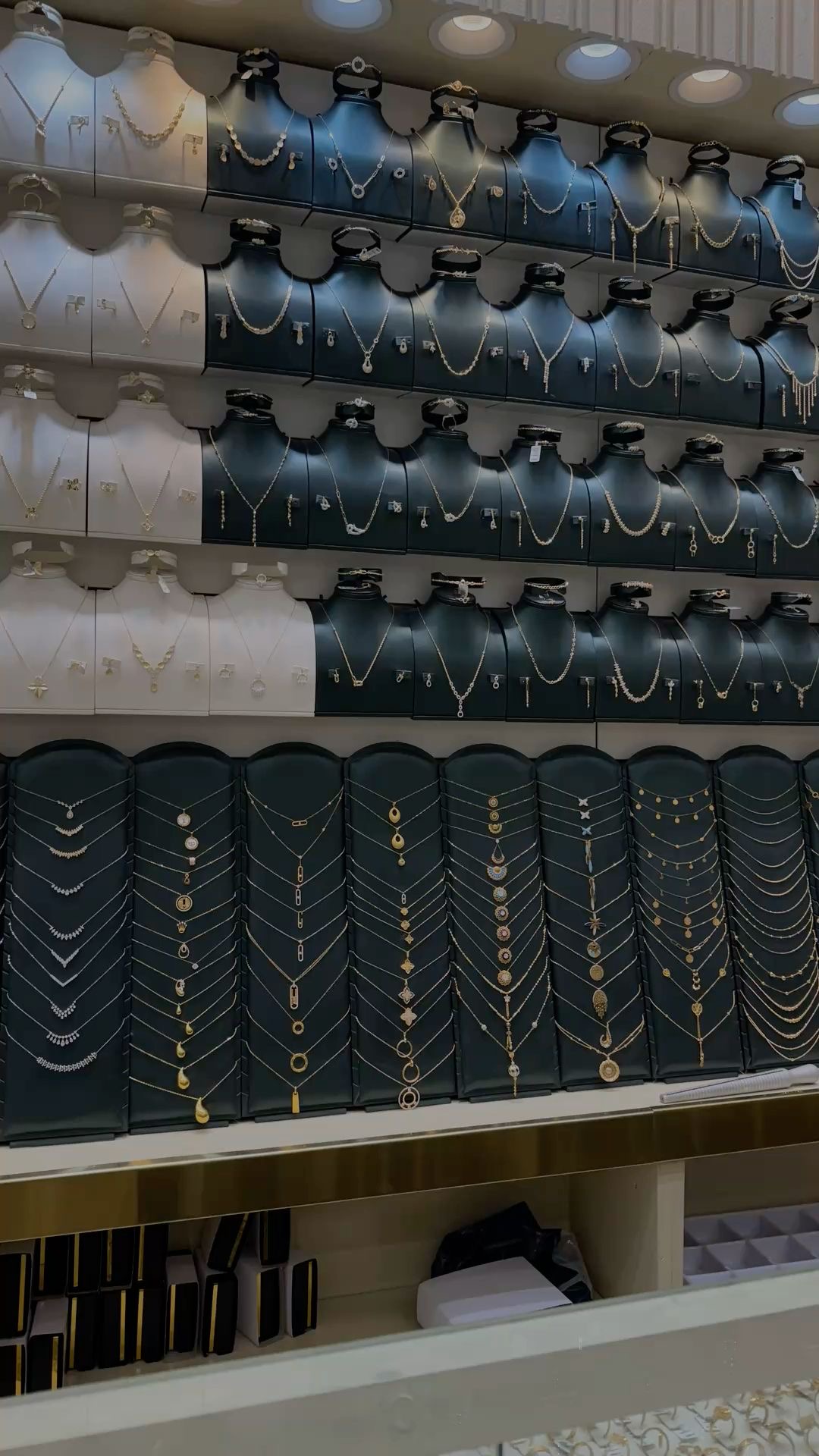 Toronto flagship fine jewelry display with rings and necklaces.